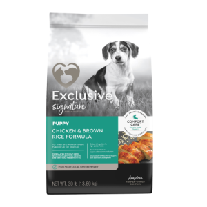 Exclusive Signature Puppy Food Chicken & Brown Rice Formula in green and grey bag with dog